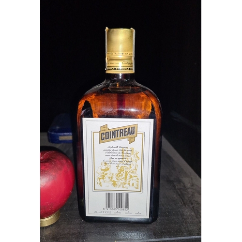 669 - 0.85L bottle of Cointreau Liqueur, produced in France. Approximately 40% alcohol by volume. Distinct... 