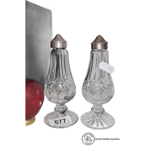 677 - Pair of Waterford crystal salt and pepper shakers with silver-plated tops, featuring an elegant cut ... 