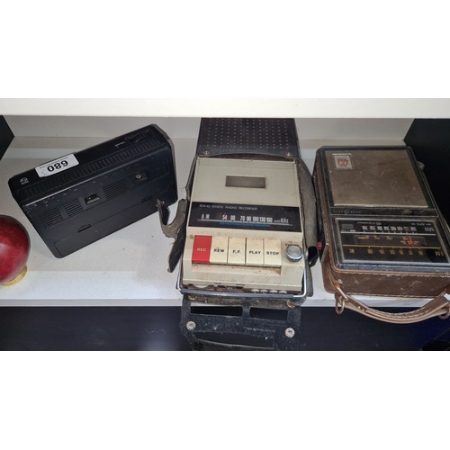 680 - Vintage electronics lot featuring a Philips radio, solid-state radio recorder, and an additional rad... 