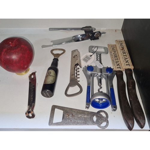 687 - Mixed lot containing vintage bottle openers and corkscrews, including a Ballantine ale and beer open... 