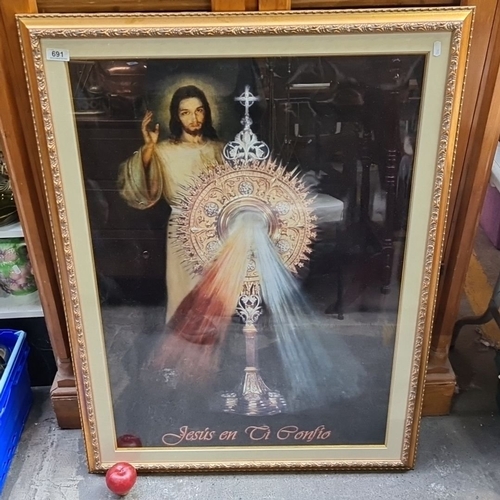 691 - Framed religious print depicting Jesus with a monstrance, inscribed 