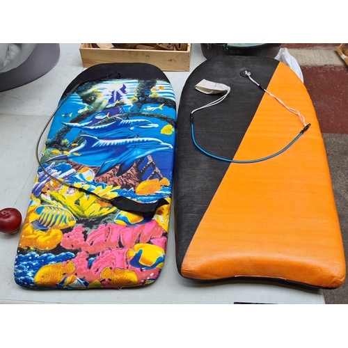 695 - Pair of bodyboards featuring vibrant ocean-themed and orange designs.