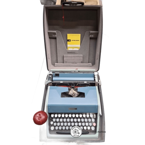 697 - Underwood 21 typewriter, vintage mechanical model with original case and manual. Features sky blue f... 