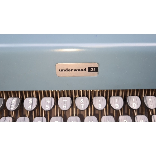 697 - Underwood 21 typewriter, vintage mechanical model with original case and manual. Features sky blue f... 