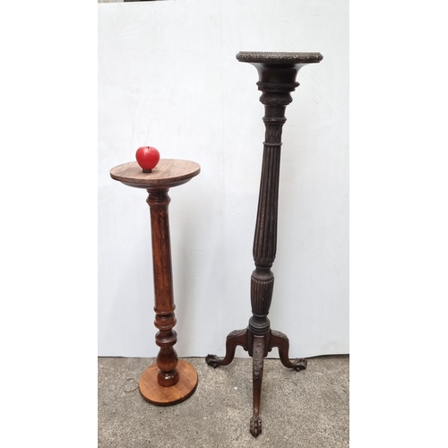 700 - Pair of wooden plant stands, one with intricate carved legs. Approximately 32 inches and 26 inches i... 