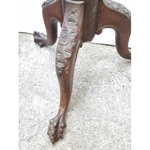 700 - Pair of wooden plant stands, one with intricate carved legs. Approximately 32 inches and 26 inches i... 