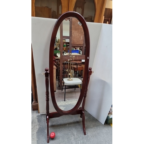 704 - Oval mahogany cheval mirror, Victorian style. Approximately 60 inches tall, 20 inches wide. Freestan... 