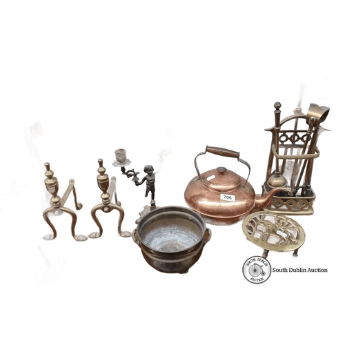 706 - Mixed lot featuring brass and copper items, including a kettle, andirons, and candle holders. Pot ma... 