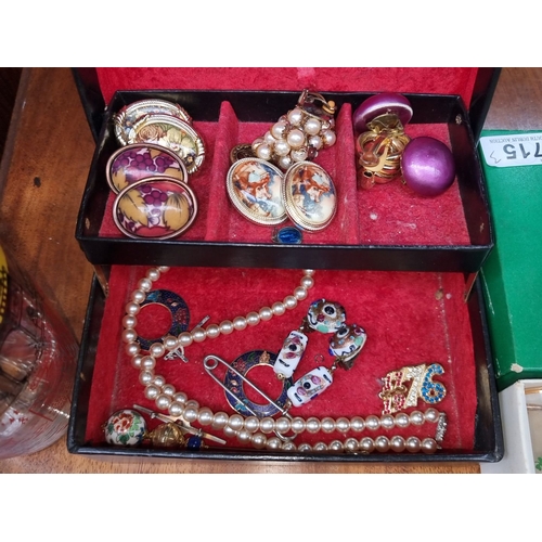 715 - Collectible glass tumbler, vintage jewelry box with assorted costume jewelry, and Shamrock sherry gl... 