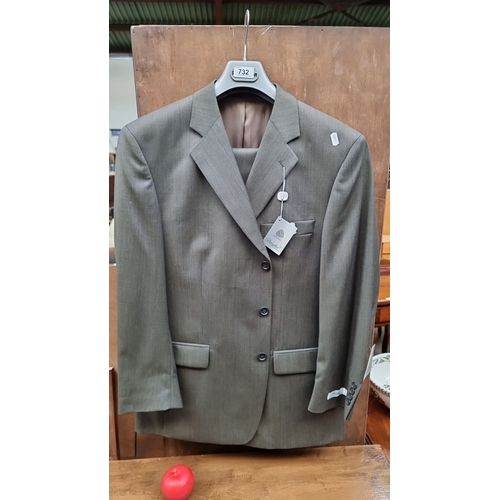 732 - A brand new 1005 Wool single breasted Douglas  Tailored suit in taupe featuring a formal cut with no... 