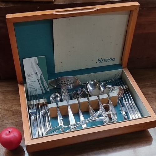 735 - A good Stager Cutlery box with a  stainless steel collection includes forks, knives, spoons, and add... 