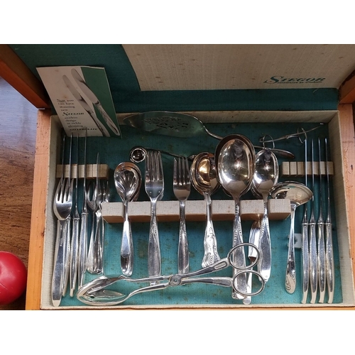 735 - A good Stager Cutlery box with a  stainless steel collection includes forks, knives, spoons, and add... 