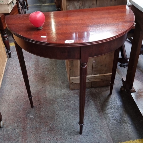 738 - A Red Mahogany demi-lune console table, Edwardian period, with tapered legs. Approximately 75cm high... 