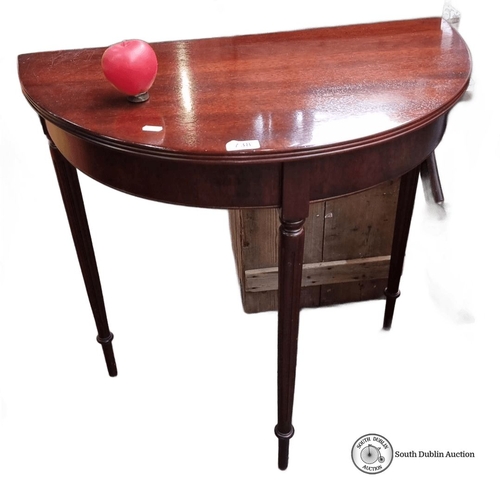 738 - A Red Mahogany demi-lune console table, Edwardian period, with tapered legs. Approximately 75cm high... 