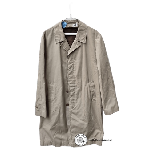 740 - A dry cleaned  beige trench coat, 65% polyester and 35% cotton. Featuring label 