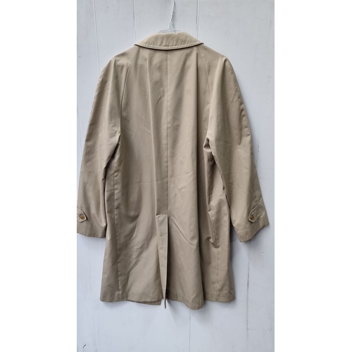 740 - A dry cleaned  beige trench coat, 65% polyester and 35% cotton. Featuring label 