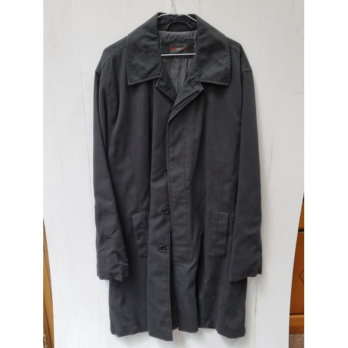 741 - Black trench coat from Butler and Webb, size XL, featuring button closure and two front pockets. In ... 