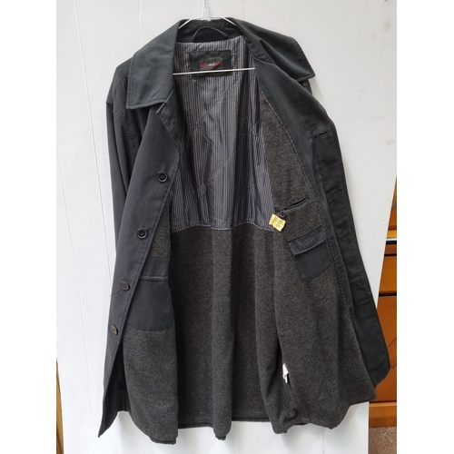 741 - Black trench coat from Butler and Webb, size XL, featuring button closure and two front pockets. In ... 