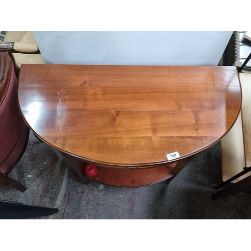 Halfmoon console table in polished mahogany with a single drawer