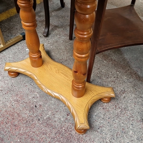 751 - Half-moon wooden side table with turned legs and carved details. Approximately 30