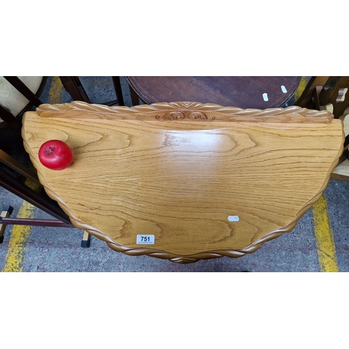 751 - Half-moon wooden side table with turned legs and carved details. Approximately 30