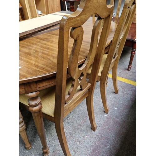 752 - Star lot : A lovely Oak extending  dining table and chairs set includes six chairs with carved backs... 