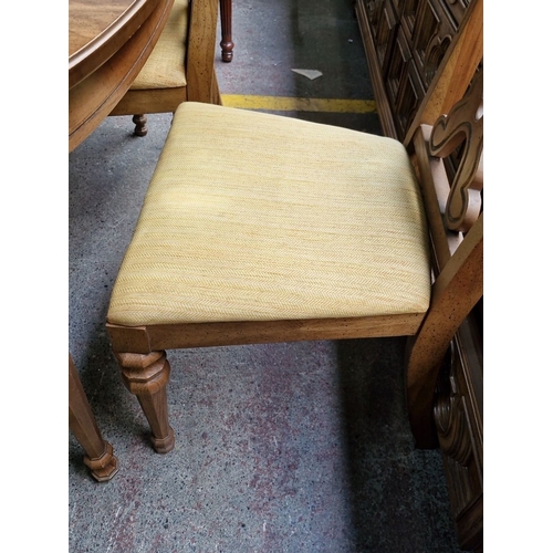 752 - Star lot : A lovely Oak extending  dining table and chairs set includes six chairs with carved backs... 