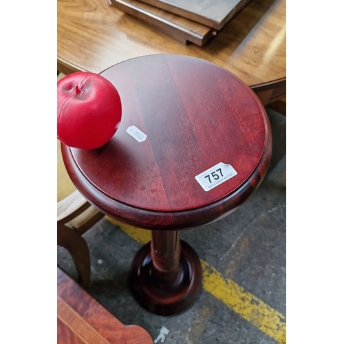 757 - Mahogany pedestal plant stand , approximately 30 inches tall, featuring a round top with a turned co... 