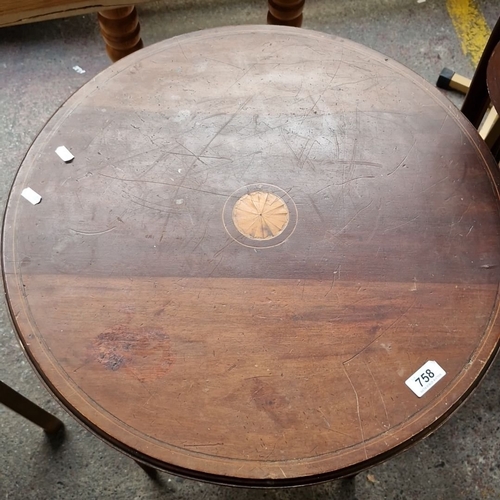 758 - Round wooden side table with inlay detail. Approximately 70 cm height, 60 cm diameter.