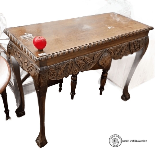 763 - Hand-carved wooden console table, featuring intricate leaf motifs and cabriole legs. Approximately 4... 