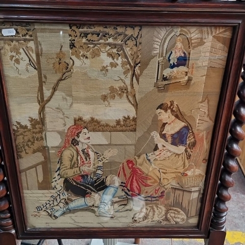 766 - Victorian walnut firescreen with intricate carved detailing, featuring a pastoral tapestry. Approxim... 