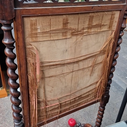 766 - Victorian walnut firescreen with intricate carved detailing, featuring a pastoral tapestry. Approxim... 