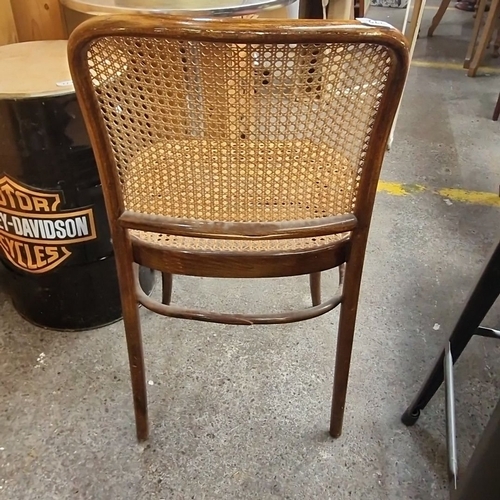 772 - Pair of vintage rattan chairs with caned seats and backs. Approximately 34 inches tall, 18 inches wi... 