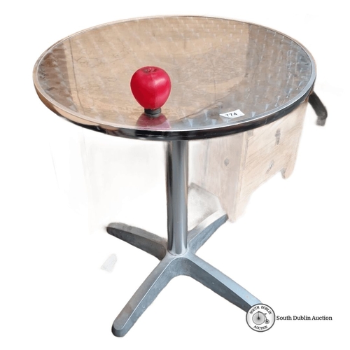 774 - Aluminum patio table with textured round top and sturdy pedestal base. Approximately 70 cm diameter,... 
