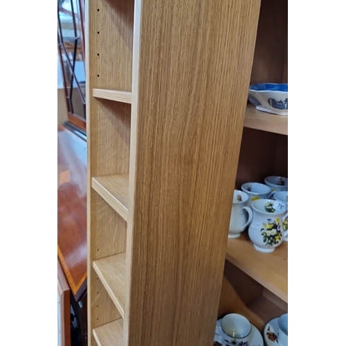 783 - A tall cd rack 180 cm high,15 cm wide, 15 cm deep.