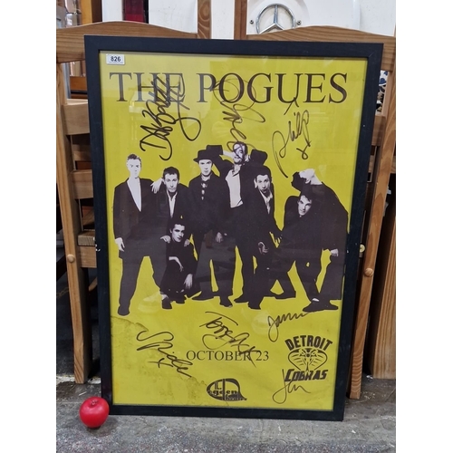 826 - Framed large poster of The Pogues, featuring printed band signatures. Approximately 24 x 36 inches.