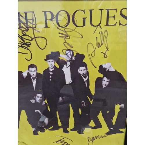 826 - Framed large poster of The Pogues, featuring printed band signatures. Approximately 24 x 36 inches.