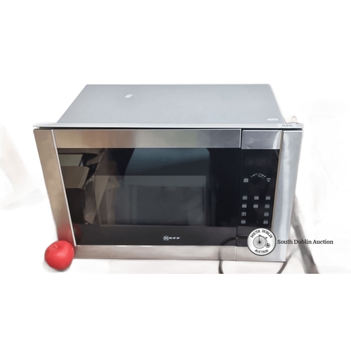 889 - Stainless steel Neff microwave oven with digital controls and a glass turntable. Model unspecified.