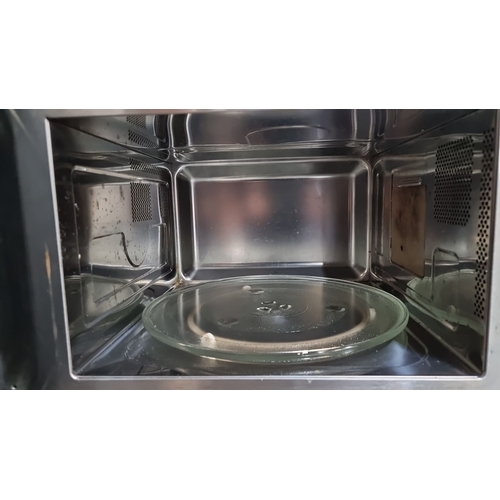 889 - Stainless steel Neff microwave oven with digital controls and a glass turntable. Model unspecified.