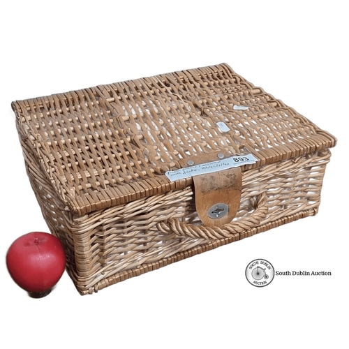 893 - Wicker picnic basket with assorted vintage linens, including embroidered and printed tablecloths. Ap... 