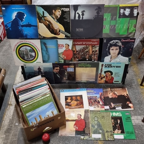 894 - Collection of vinyl records featuring iconic artists such as Johnny Cash, including 