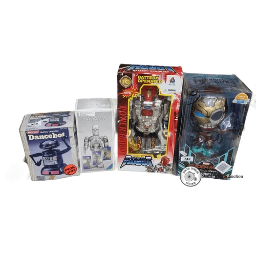 905 - Set of four battery-operated robot toys, including Dancebot and Power Robot, in original packaging. ... 