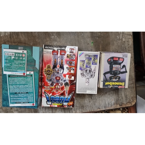 905 - Set of four battery-operated robot toys, including Dancebot and Power Robot, in original packaging. ... 