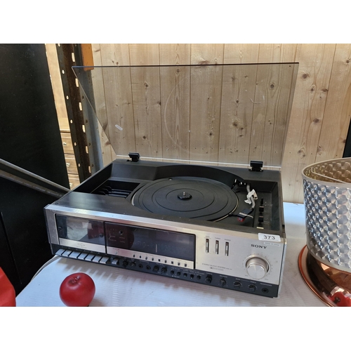 373 - A vintage Sony stereo music system HMK-44, a turntable record player with smoked glass cover and cas... 