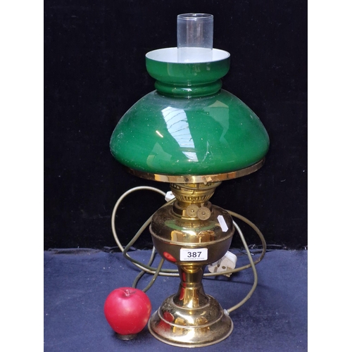 387 - An elegant Victorian oil lamp with Duplex fittings. Recently electrified for modern use. Featuring a... 