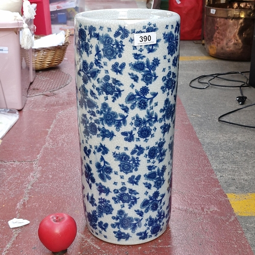 390 - A tall blue and white floral ceramic umbrella stand. In very good condition.