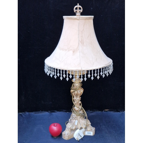 395 - A designer tall table lamp by RVA lighting featuring elegantly decorative column with blush pink sha... 