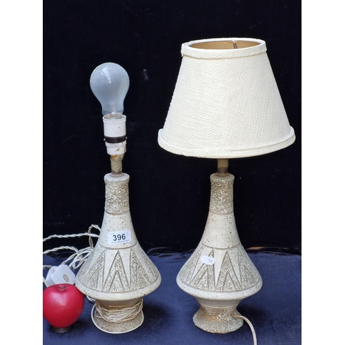 396 - A pair of vintage matching textured beige table lamps. One with textured fabric shade.