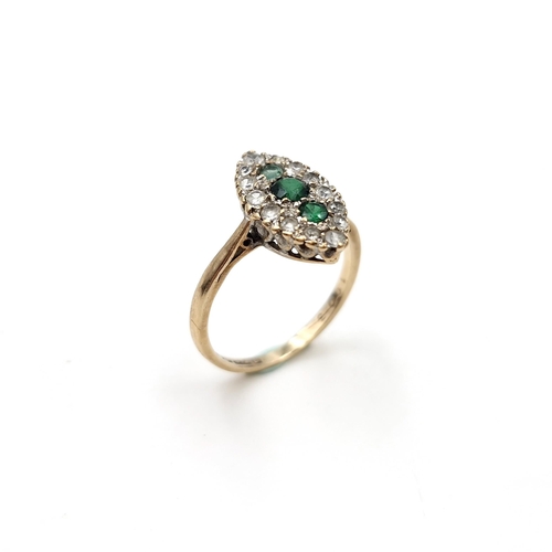 1117 - A nine carat gold (375) and Emerald gem set ring. Ring size - K 1/2. Weight - 1.75 grams. Boxed.