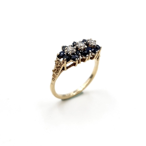 1118 - A pretty vintage sapphire ring with three gemstone accents mounted in nine carat gold. Ring size - K... 